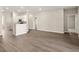 Open-concept living room and kitchen with stainless steel appliances and wood floors at 2634 58Th E Cir, Palmetto, FL 34221