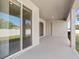 Covered patio with sliding glass doors, perfect for outdoor dining and entertainment at 2634 58Th E Cir, Palmetto, FL 34221