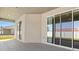 Covered patio with sliding glass doors, offering a seamless transition to outdoor living at 2634 58Th E Cir, Palmetto, FL 34221