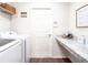 Bright laundry room features washer, dryer, and ample counter space at 2650 58Th E Cir, Palmetto, FL 34221