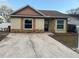 Front exterior of a single-story home with a driveway and landscaping at 4652 E Eastwind Dr, Plant City, FL 33566