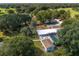 Aerial view showing the main house, pool, and surrounding landscape at 4911 W Sam Allen Rd, Plant City, FL 33565