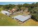 Aerial view of multiple animal enclosures and barns at 4911 W Sam Allen Rd, Plant City, FL 33565