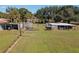 Various animal enclosures with wooden and metal structures at 4911 W Sam Allen Rd, Plant City, FL 33565