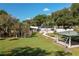 Landscaped backyard featuring a gazebo and pool area at 4911 W Sam Allen Rd, Plant City, FL 33565