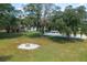 Large backyard with fire pit and spacious, open area at 4911 W Sam Allen Rd, Plant City, FL 33565