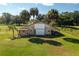 Rustic wooden barn with large doors and open space at 4911 W Sam Allen Rd, Plant City, FL 33565