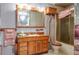 Elegant bathroom with wood vanity and shower at 4911 W Sam Allen Rd, Plant City, FL 33565