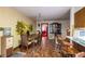 Charming dining area with a mountain mural and wood furniture at 4911 W Sam Allen Rd, Plant City, FL 33565