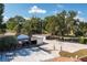 Long driveway leading to a large home with detached garage at 4911 W Sam Allen Rd, Plant City, FL 33565