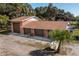Three-car brick garage with additional covered area at 4911 W Sam Allen Rd, Plant City, FL 33565