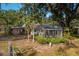 Brick house exterior with screened gazebo in backyard at 4911 W Sam Allen Rd, Plant City, FL 33565
