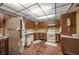 Retro kitchen with wood cabinets and tiled floor at 4911 W Sam Allen Rd, Plant City, FL 33565