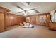 Large storage room with wood paneling and ample space for storage at 4911 W Sam Allen Rd, Plant City, FL 33565