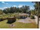 Small storage shed with additional covered area at 4911 W Sam Allen Rd, Plant City, FL 33565
