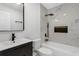Modern bathroom with marble tile shower, and black vanity at 1820 Douglas Ave, Clearwater, FL 33755