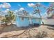 Charming exterior of a home with a well-maintained yard and front door at 1820 Douglas Ave, Clearwater, FL 33755