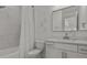 Modern bathroom with marble tile and a vanity with a quartz countertop at 11449 Owasee Trails Pl, Riverview, FL 33569