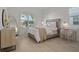 Bright bedroom featuring a comfortable bed and built-in desk at 11449 Owasee Trails Pl, Riverview, FL 33569