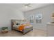 Cozy bedroom with a gray bed frame and orange accents at 11449 Owasee Trails Pl, Riverview, FL 33569