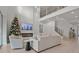 Two-story living room with a fireplace and large windows at 11449 Owasee Trails Pl, Riverview, FL 33569