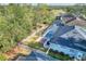 Aerial view showing home, pool, and large backyard at 5352 Camberlea Ave, Zephyrhills, FL 33541