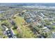 Aerial view of house near golf course and lake at 5352 Camberlea Ave, Zephyrhills, FL 33541