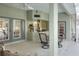 Relaxing covered patio with seating area, access to kitchen, and view of backyard at 5352 Camberlea Ave, Zephyrhills, FL 33541