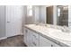 Double vanity bathroom with white cabinets and a shower at 2504 58Th E Cir, Palmetto, FL 34221