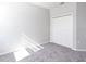 Bright bedroom with gray carpeting and double door closet at 2504 58Th E Cir, Palmetto, FL 34221