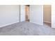 Bedroom with carpet, closet and door to bathroom at 2504 58Th E Cir, Palmetto, FL 34221