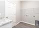 Laundry room with built-in shelving and flooring at 2504 58Th E Cir, Palmetto, FL 34221