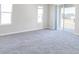 Living area with gray carpet and sliding glass doors at 2504 58Th E Cir, Palmetto, FL 34221