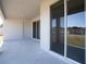 Covered patio with sliding glass doors and concrete flooring at 2504 58Th E Cir, Palmetto, FL 34221