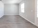 Room with grey vinyl plank flooring and a window at 2504 58Th E Cir, Palmetto, FL 34221