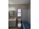 This bathroom boasts a vanity, sink, mirror with lights, toilet, and bathtub at 3967 Arkansas Ne Ave, St Petersburg, FL 33703