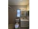 This bathroom offers a shower, toilet, vanity, sink, and a mirror with lighting at 3967 Arkansas Ne Ave, St Petersburg, FL 33703
