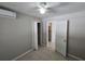 Comfortable bedroom with an air conditioning unit and convenient access to closet at 3967 Arkansas Ne Ave, St Petersburg, FL 33703