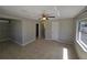 Bright bedroom featuring neutral walls, tile flooring, and a ceiling fan for added comfort at 3967 Arkansas Ne Ave, St Petersburg, FL 33703