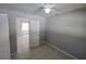 Bedroom featuring tile floors, a ceiling fan, and a view to another room at 3967 Arkansas Ne Ave, St Petersburg, FL 33703