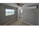 Bedroom featuring neutral paint, tile floors, and a window letting in natural light at 3967 Arkansas Ne Ave, St Petersburg, FL 33703