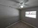 Minimalist bedroom with neutral walls, a window, and tile flooring at 3967 Arkansas Ne Ave, St Petersburg, FL 33703