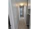 Hallway with tile flooring and neutral colored walls connecting different rooms at 3967 Arkansas Ne Ave, St Petersburg, FL 33703