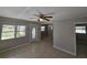 Inviting living room showcasing tile floors, neutral paint, and a ceiling fan for added comfort at 3967 Arkansas Ne Ave, St Petersburg, FL 33703