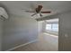 Comfortable living room boasting tile floors, neutral paint, and a ceiling fan for enhanced air circulation at 3967 Arkansas Ne Ave, St Petersburg, FL 33703