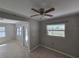 Open living area featuring tile floors and neutral paint, offering a bright and airy feel at 3967 Arkansas Ne Ave, St Petersburg, FL 33703