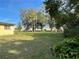 Expansive backyard with mature trees offers a serene and private outdoor space at 750 Charlie Taylor Rd, Plant City, FL 33566