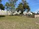 Fenced-in backyard space with lush green grass and storage shed at 750 Charlie Taylor Rd, Plant City, FL 33566