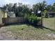 View of a fenced-in backyard featuring mature trees and plenty of green space at 750 Charlie Taylor Rd, Plant City, FL 33566