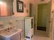 Charming pink bathroom featuring a unique sink and decorative accents at 750 Charlie Taylor Rd, Plant City, FL 33566